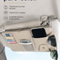 Organisateur de pare-soleil noir installé dans une voiture, montrant des documents et des accessoires bien rangés.