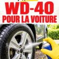 Un flacon de WD-40 placé sur un capot de voiture avec des outils à proximité.